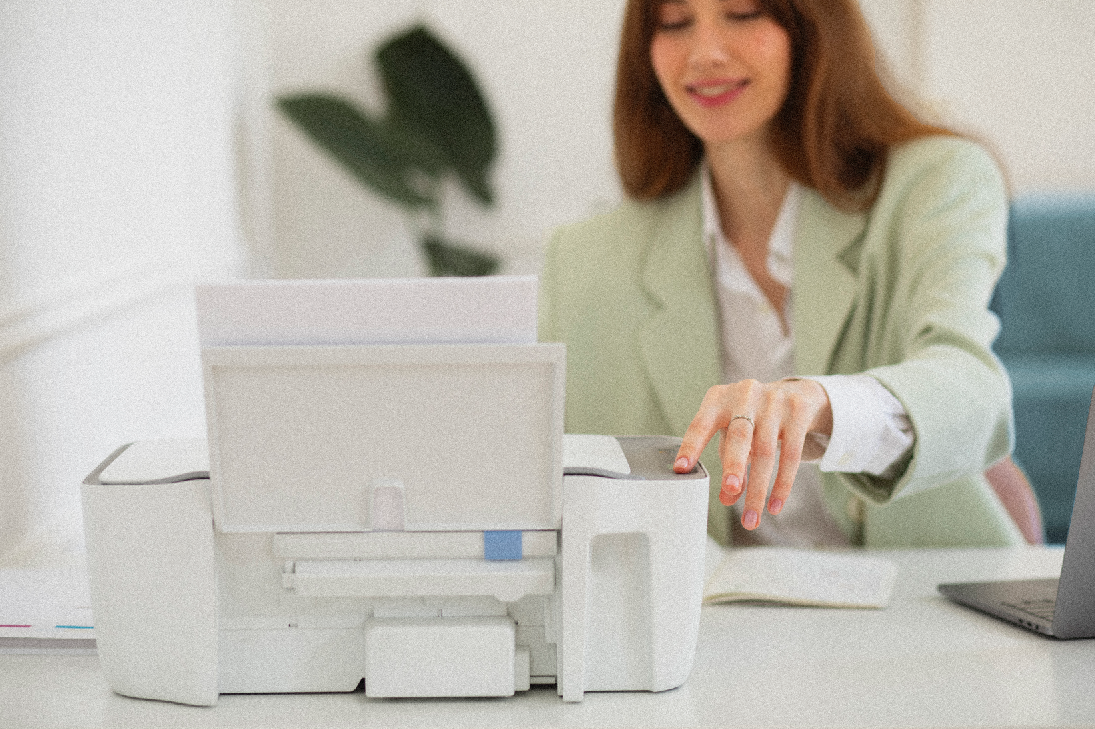 woman using a printer in her home, home office